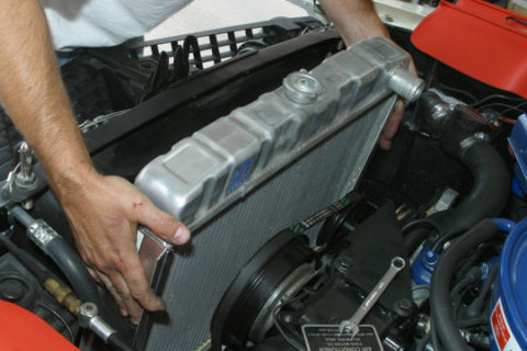 Image of a vehicle's radiator being installed