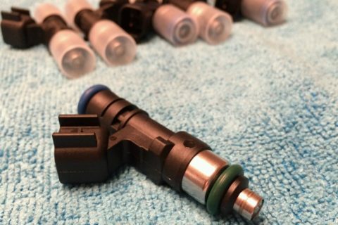 Image of fuel injectors placped on a carpet